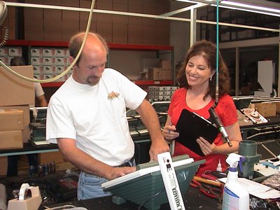 A Man And Woman Diligently Working Together On Massager